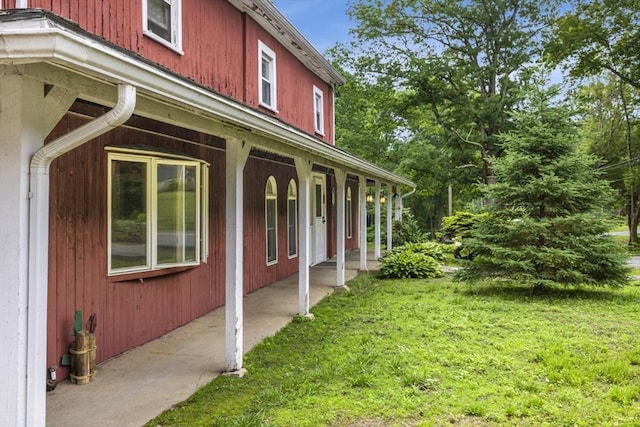 121 Liberty St, Middleton, MA 01949 - view of side of property featuring covered porch and a lawn