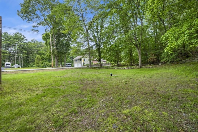 121 Liberty St, Middleton, MA 01949 - view of green lawn featuring a garage