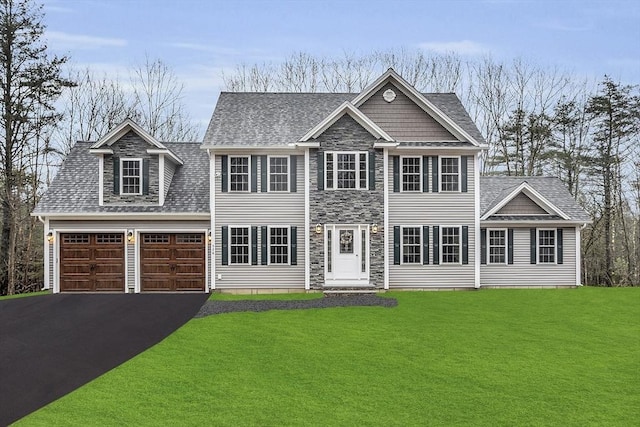 62 Bolton Rd Applewood, Unit Applewood, Westminster, MA 01473 - view of front facade with driveway, stone siding, a front yard, and roof with shingles