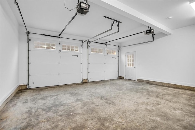 62 Bolton Rd Applewood, Unit Applewood, Westminster, MA 01473 - garage featuring a garage door opener and baseboards