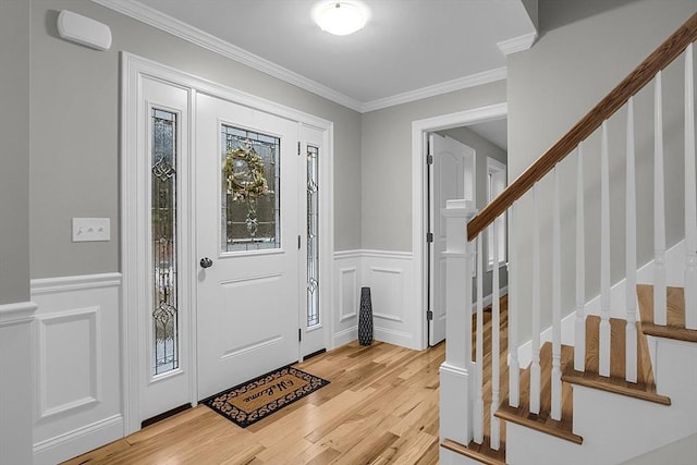 62 Bolton Rd Applewood, Unit Applewood, Westminster, MA 01473 - foyer entrance with a decorative wall, light wood finished floors, crown molding, wainscoting, and stairway