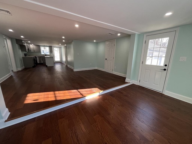 foyer entrance featuring dark wood-type flooring