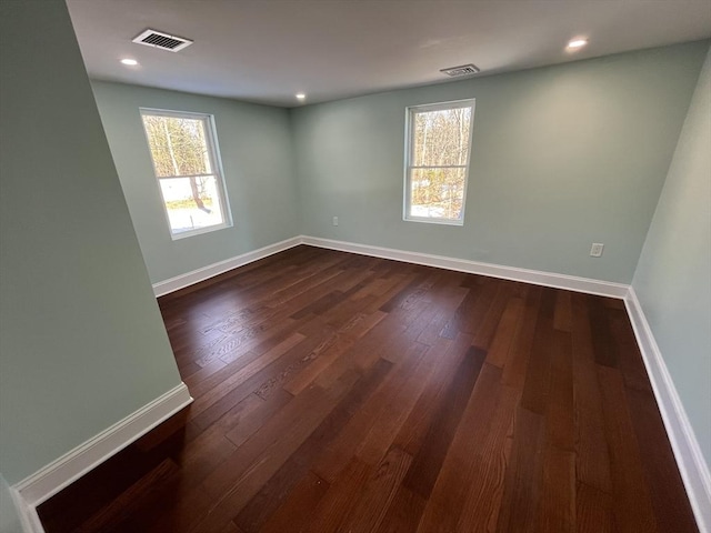 unfurnished room featuring dark hardwood / wood-style floors