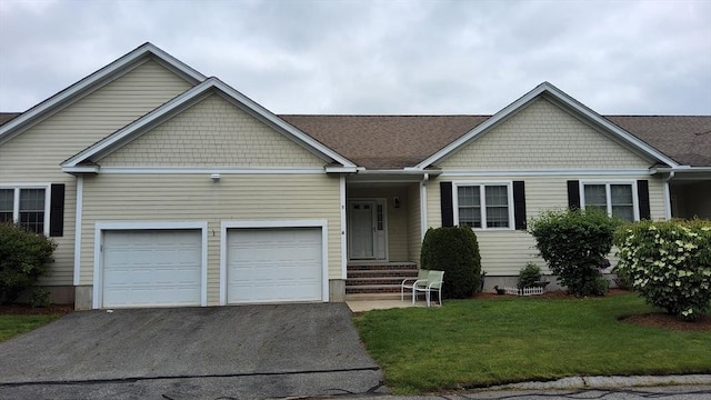 9 Village Ln Unit 5, Methuen, MA 01844 - view of front of property with asphalt driveway, a front yard, and an attached garage