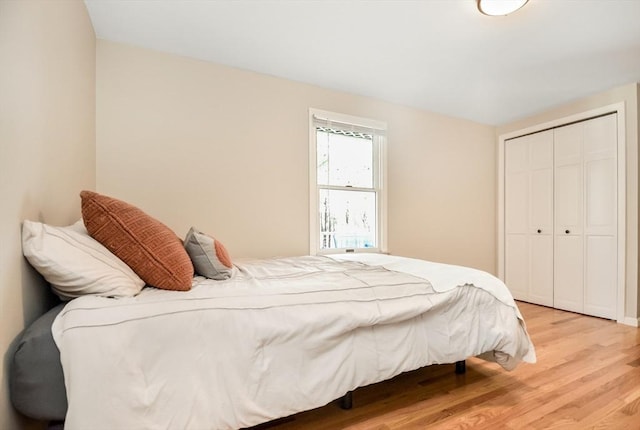 bedroom featuring a closet and wood finished floors