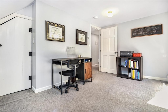 carpeted office space with baseboards