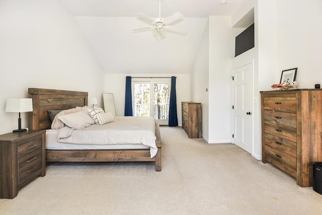bedroom with light colored carpet, a ceiling fan, baseboards, and lofted ceiling
