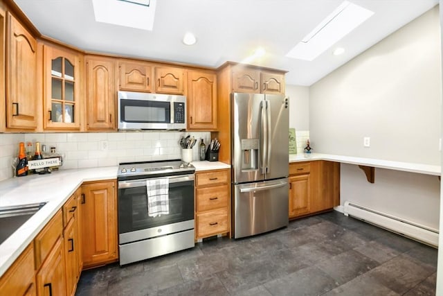 kitchen featuring appliances with stainless steel finishes, decorative backsplash, a baseboard radiator, a skylight, and glass insert cabinets
