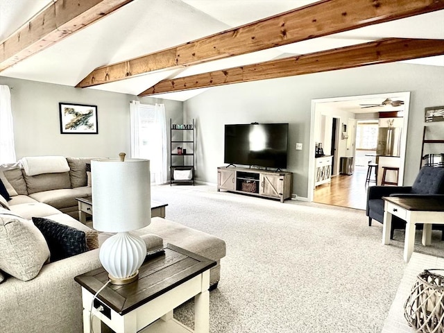 living room featuring carpet flooring, ceiling fan, and baseboards