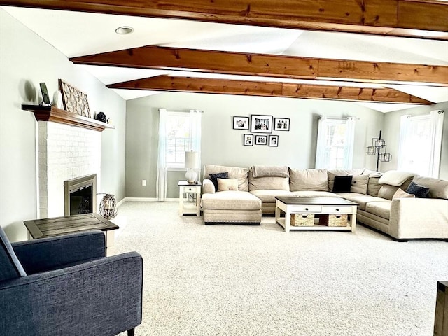 living room with baseboards and a fireplace