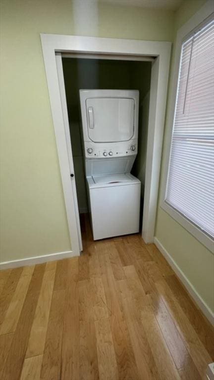 33 Williams St, New London, CT 06320 - laundry area featuring stacked washer / drying machine and light wood-type flooring