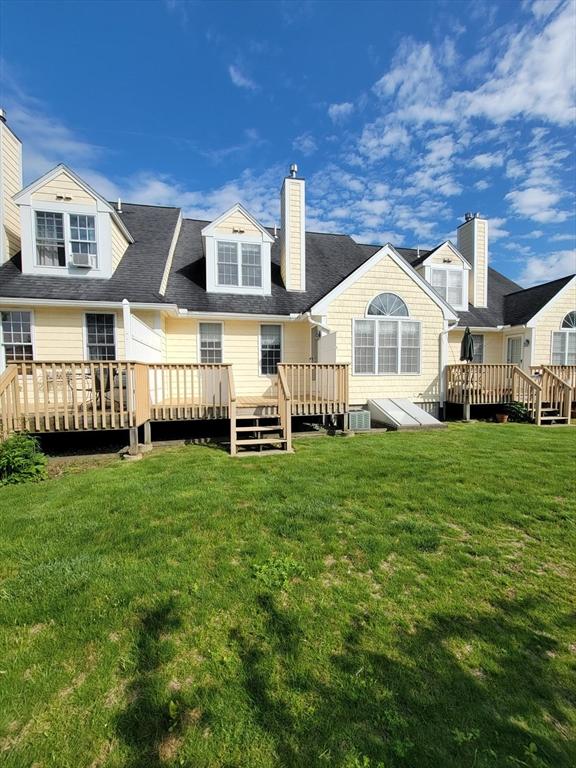 281 Rowley Bridge Rd Unit 7, Topsfield, MA 01983 - rear view of property featuring a wooden deck, a yard, cooling unit, and a chimney
