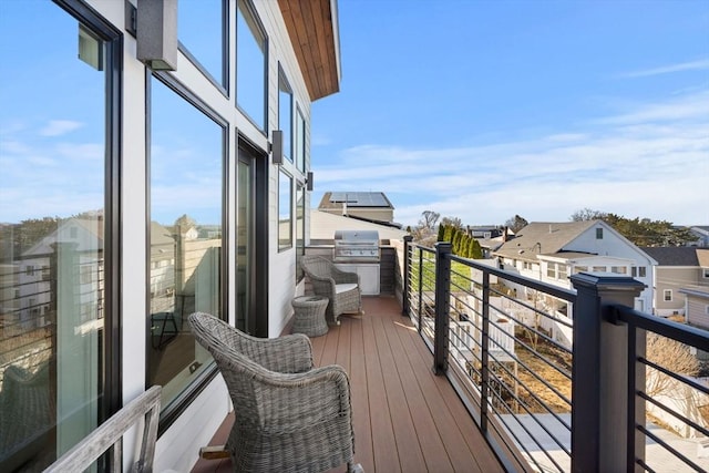 balcony featuring area for grilling and a residential view