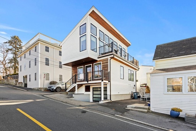 view of front of house featuring a balcony