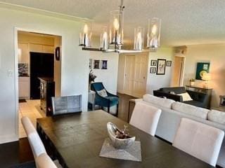 40 Village Rd Unit 606, Middleton, MA 01949 - dining area with a textured ceiling