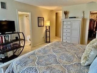 40 Village Rd Unit 606, Middleton, MA 01949 - bedroom featuring baseboards and a spacious closet