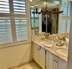 40 Village Rd Unit 606, Middleton, MA 01949 - full bath with a chandelier and double vanity