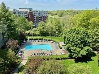40 Village Rd Unit 606, Middleton, MA 01949 - aerial view of a pool area and a forest