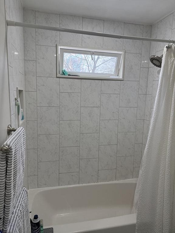 bathroom with shower / tub combo