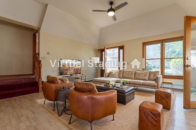 135 Main St, Blackstone, MA 01504 - living room featuring light wood-style floors, stairs, a ceiling fan, and high vaulted ceiling