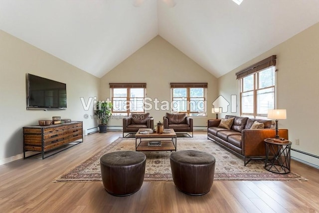 135 Main St, Blackstone, MA 01504 - living room with high vaulted ceiling, light wood-style flooring, healthy amount of natural light, and baseboard heating