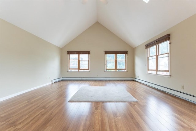 135 Main St, Blackstone, MA 01504 - unfurnished room with plenty of natural light, wood finished floors, a baseboard radiator, and high vaulted ceiling