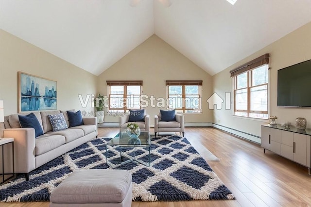 135 Main St, Blackstone, MA 01504 - living room featuring high vaulted ceiling, light wood finished floors, a baseboard radiator, and a ceiling fan