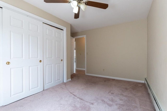 135 Main St, Blackstone, MA 01504 - unfurnished bedroom with a baseboard heating unit, carpet floors, a closet, and a ceiling fan