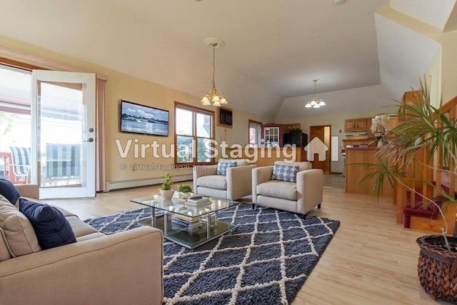 135 Main St, Blackstone, MA 01504 - living room with a baseboard heating unit, a chandelier, light wood-style floors, and lofted ceiling