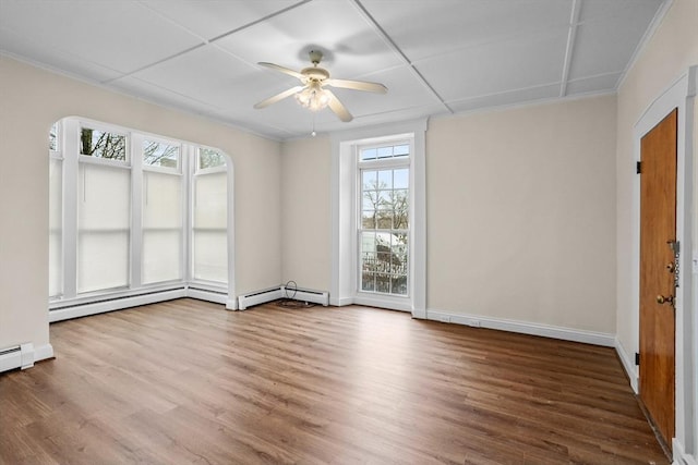 spare room with hardwood / wood-style floors and ceiling fan