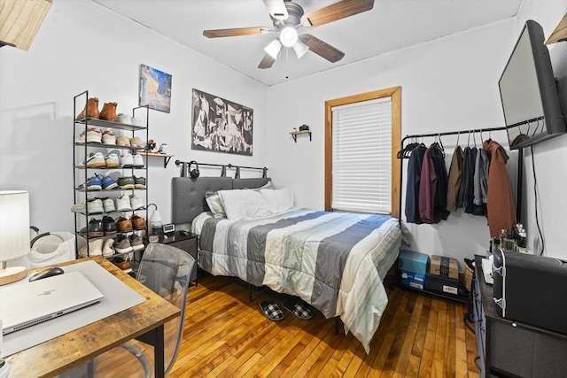 bedroom featuring ceiling fan and hardwood / wood-style floors