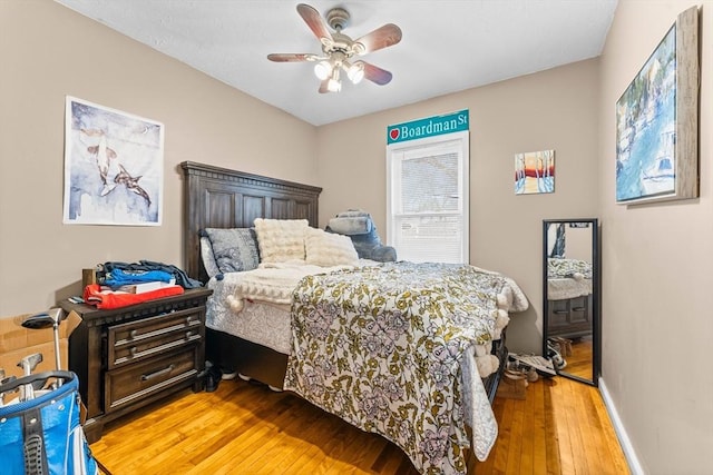 bedroom featuring ceiling fan and light hardwood / wood-style flooring