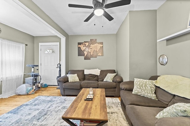 living room with light hardwood / wood-style floors and ceiling fan