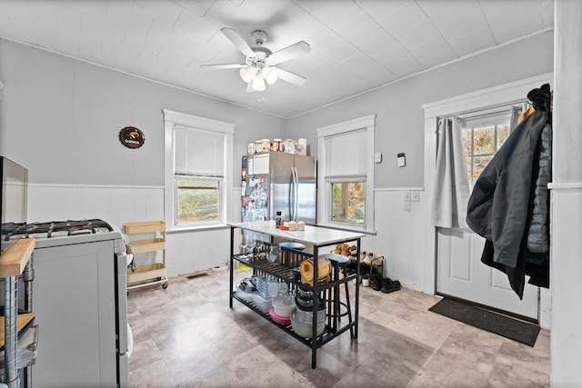 interior space featuring plenty of natural light and ceiling fan