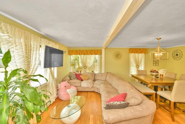 120 E Ashland St, Brockton, MA 02302 - living area featuring a chandelier, light wood finished floors, and beamed ceiling