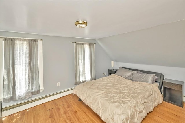 120 E Ashland St, Brockton, MA 02302 - bedroom featuring lofted ceiling, light wood-type flooring, and baseboard heating