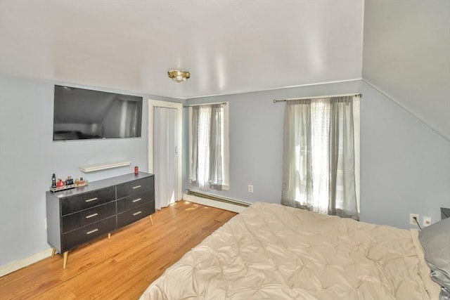 120 E Ashland St, Brockton, MA 02302 - bedroom with a baseboard radiator, light wood-style flooring, and multiple windows