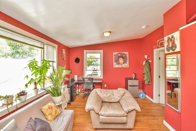 120 E Ashland St, Brockton, MA 02302 - living room featuring light wood-type flooring, an office area, vaulted ceiling, and baseboards