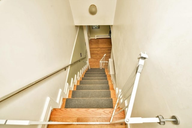 120 E Ashland St, Brockton, MA 02302 - stairway with a baseboard heating unit