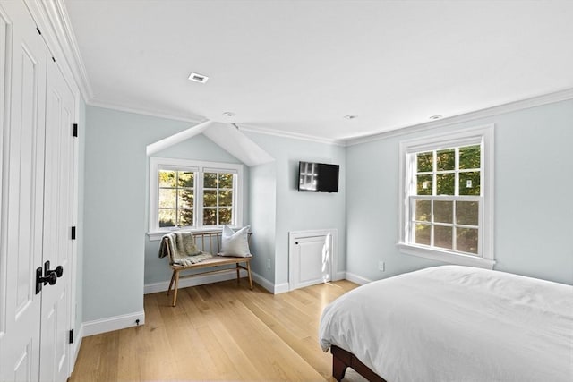 1164 Main St, Hingham, MA 02043 - bedroom featuring multiple windows, light wood-style flooring, baseboards, and ornamental molding