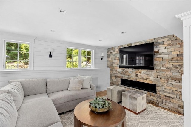 1164 Main St, Hingham, MA 02043 - living room with plenty of natural light, wood finished floors, and a fireplace
