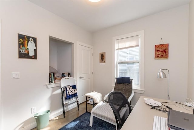 office with dark wood finished floors and baseboards