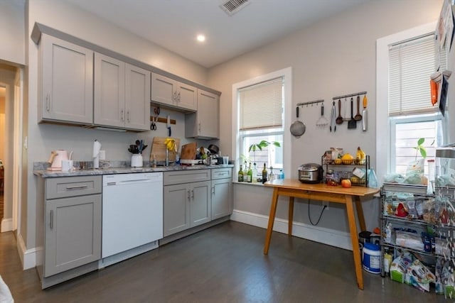 kitchen featuring white dishwasher, gray cabinetry, dark wood-style flooring, a sink, and recessed lighting