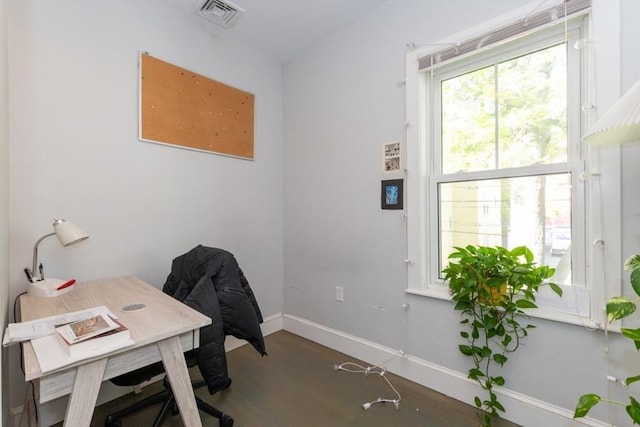 office space with baseboards and wood finished floors