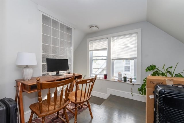 office space featuring lofted ceiling, wood finished floors, and baseboards