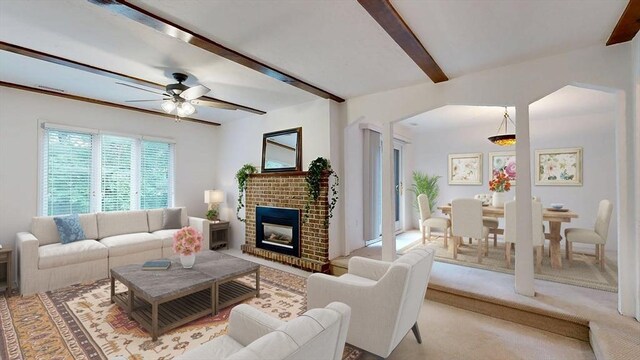 33 Cobblestone Ln Unit 33, Worcester, MA 01606 - living room with beamed ceiling, a brick fireplace, and a ceiling fan