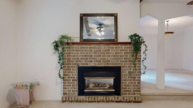 33 Cobblestone Ln Unit 33, Worcester, MA 01606 - detailed view of a brick fireplace, ceiling fan, and carpet flooring