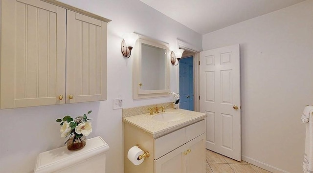 33 Cobblestone Ln Unit 33, Worcester, MA 01606 - bathroom featuring toilet, vanity, tile patterned flooring, and baseboards