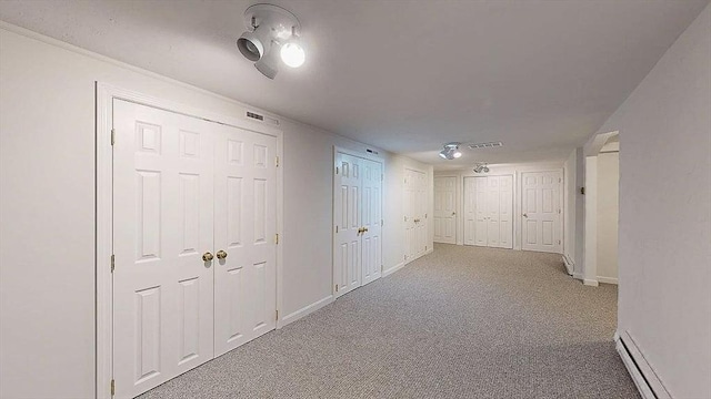33 Cobblestone Ln Unit 33, Worcester, MA 01606 - corridor featuring a baseboard heating unit, carpet floors, and baseboards