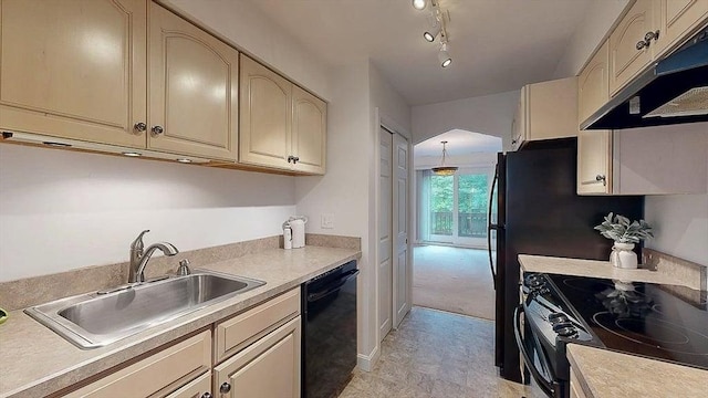33 Cobblestone Ln Unit 33, Worcester, MA 01606 - kitchen featuring black appliances, under cabinet range hood, cream cabinets, a sink, and light countertops